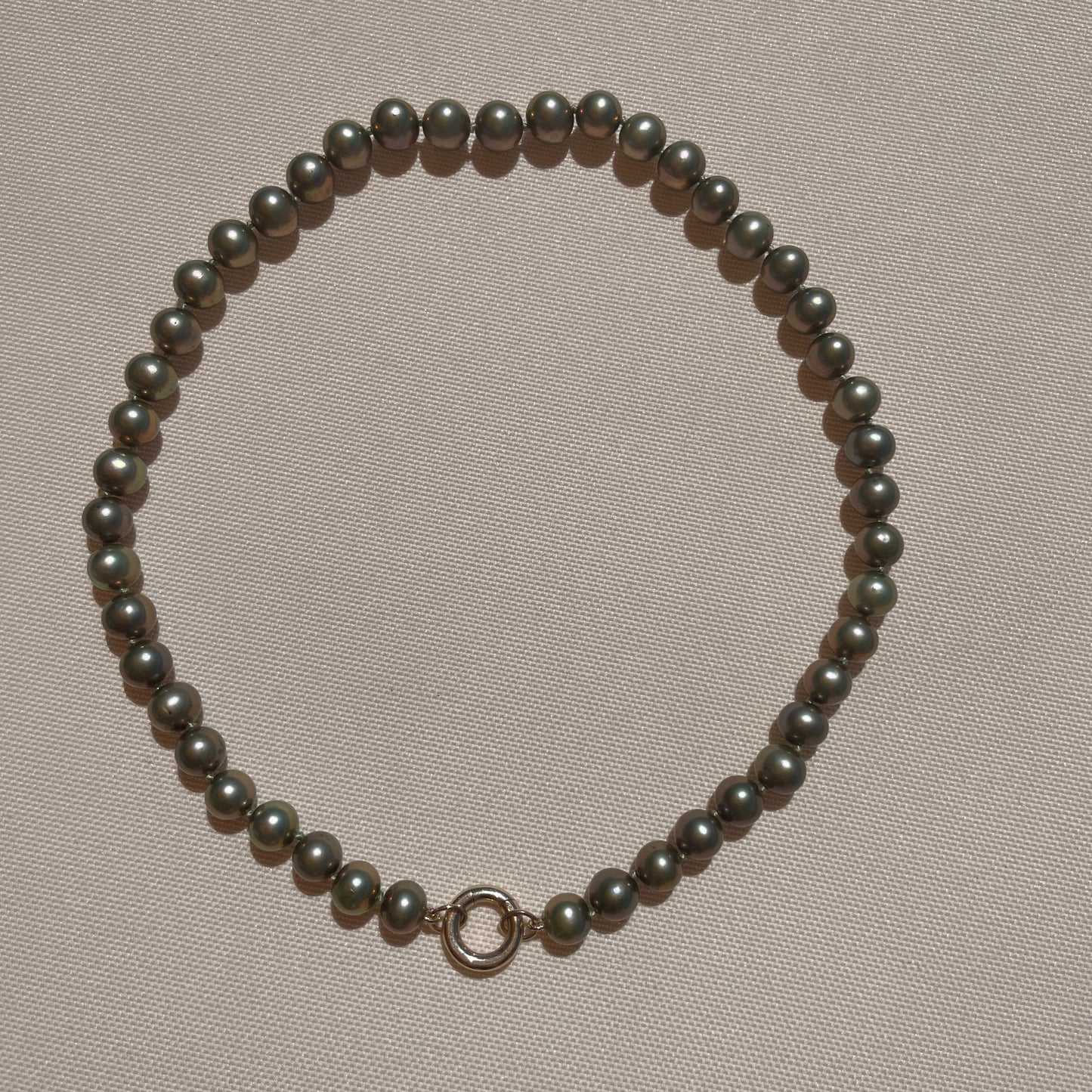 olive pearls with charm enhancer