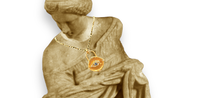 evil eye in yellow gold wih sapphire and diamond on a roman statue 