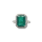 Emerald and diamond halo ring