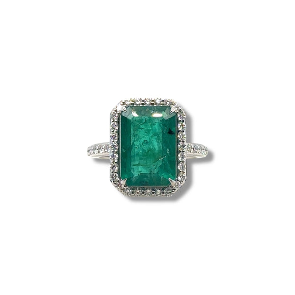 Emerald and diamond halo ring