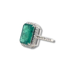 Emerald and diamond halo ring