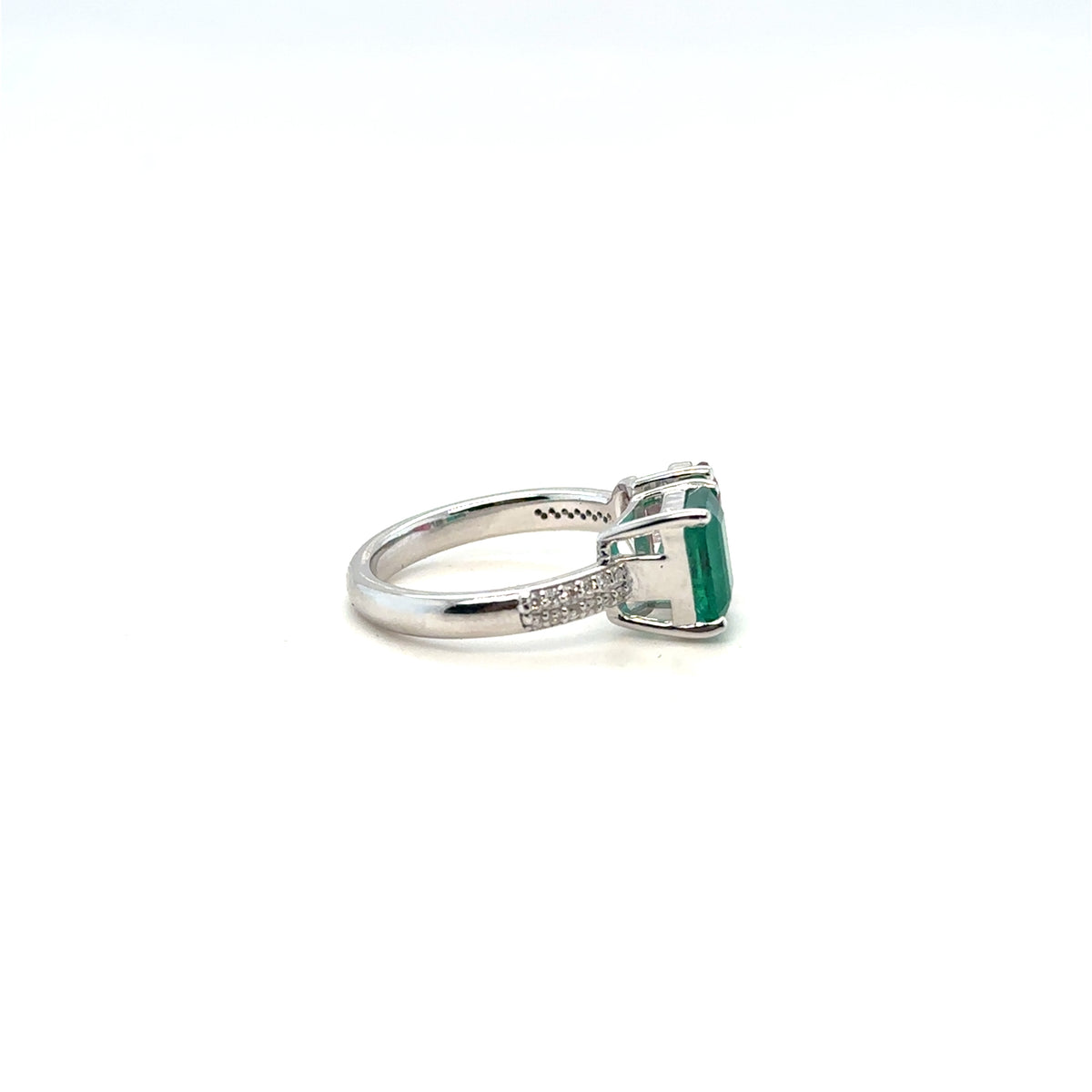 Emerald and diamond halo ring