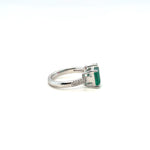 Emerald and diamond halo ring