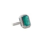 Emerald and diamond halo ring