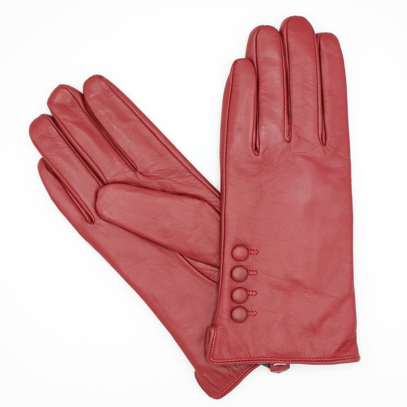 Pair of red gloves with buttons on a white background