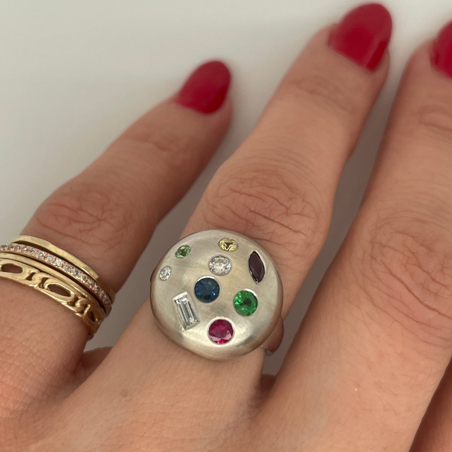 colorful gemstone ring on the hand