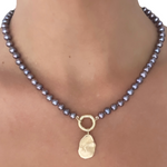 lilac pearls on the neck
