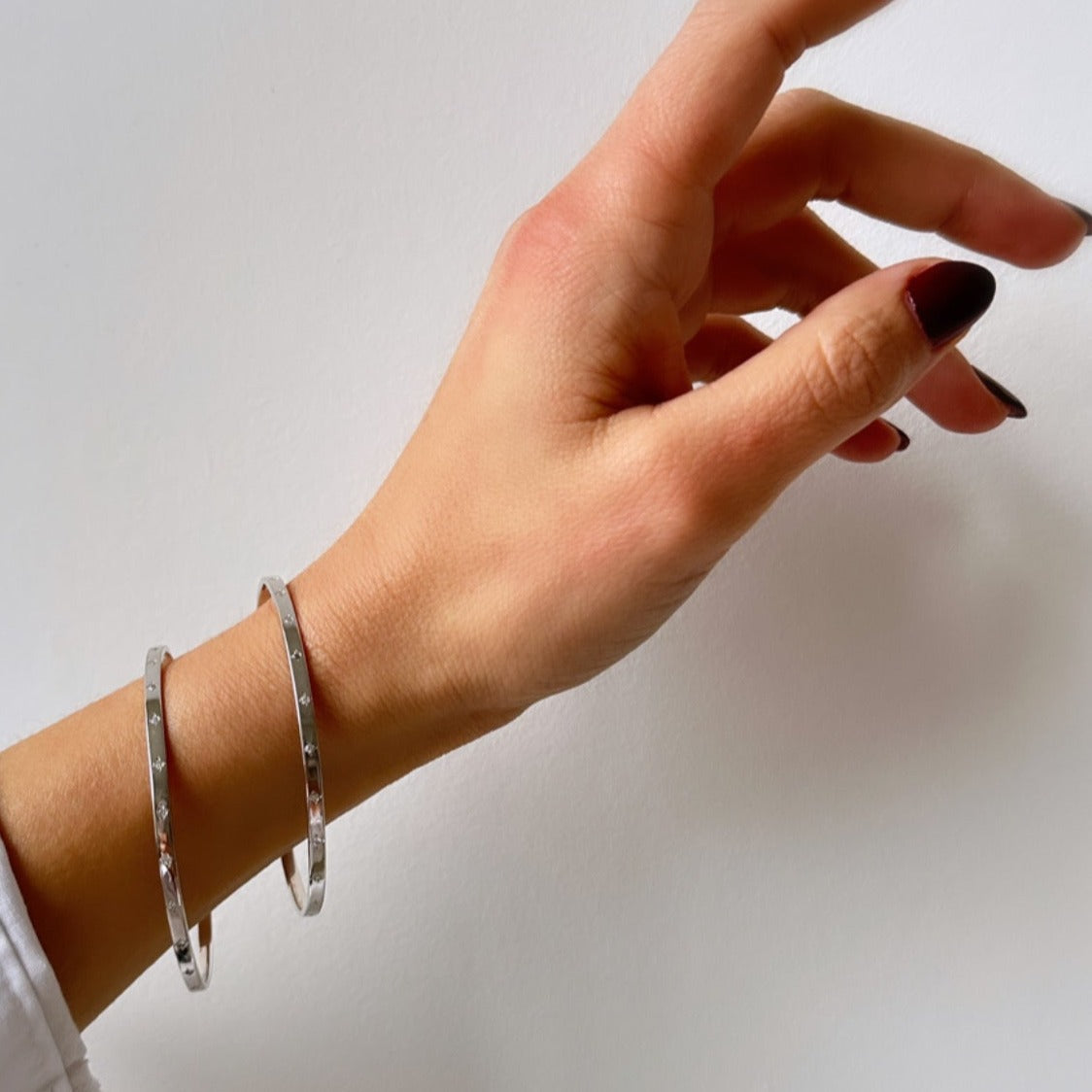 starburst bangle on the wrist